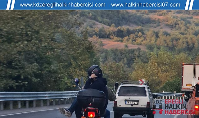 Motosiklette bacak bacak üstüne atarak yolculuk yaptı